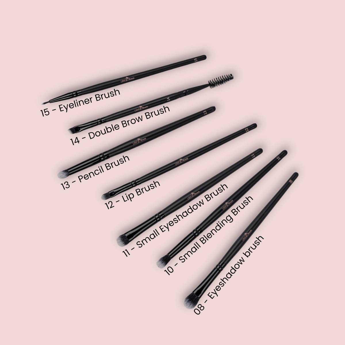 Set of makeup brushes with labels on a pink background