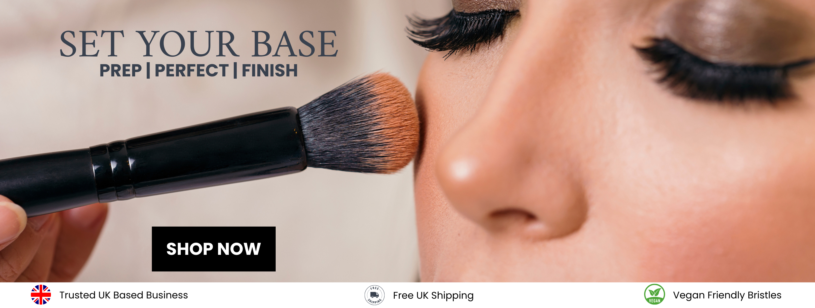 woman applying foundation makeup with black brush