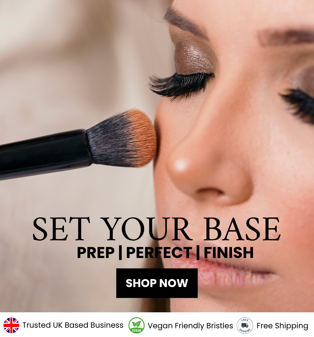 woman applying foundation makeup with black brush