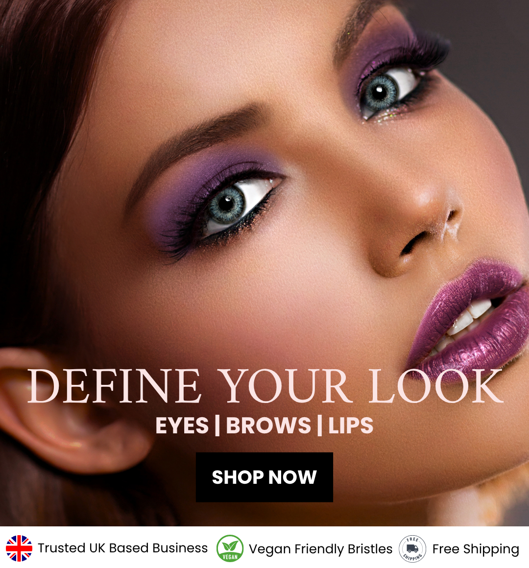 Female posing with purple lipstick and eyeshadow
